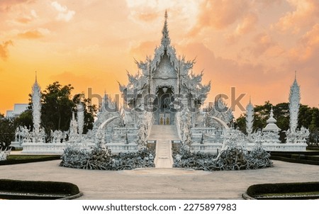 Sunset at the White Temple Chiang Rai Thailand, Wat Rong Khun, Northern Thailand. Royalty-Free Stock Photo #2275897983