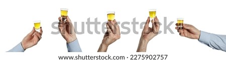 man's hand with a shot of whiskey isolated Royalty-Free Stock Photo #2275902757