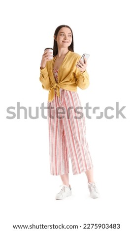 Pretty young woman with smartphone and coffee against white background