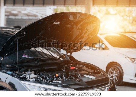 Car crash open hood car mechanic to check condition of damage. See the radiator cooling panel Engine and electronic system for mechanic to check damage thoroughly to repair engine to complete for use. Royalty-Free Stock Photo #2275919393