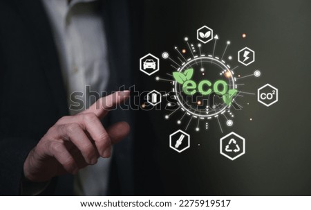 Entrepreneur hand point at digital screen dashboard while control and reduce carbon emission for global friendly business. Business with environment concern, carbon credit and zero emission Royalty-Free Stock Photo #2275919517