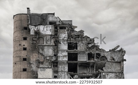 destroyed and burned houses in the city during the war in Ukraine Royalty-Free Stock Photo #2275932507