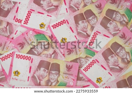 Indonesian rupiah banknotes series with the value of one hundred thousand rupiah IDR 100.000 issued since 2004, Indonesian rupiah for background

 Royalty-Free Stock Photo #2275933559