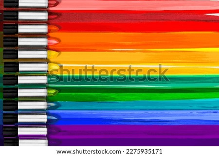 Lipstick makeup concept. Set of multicolored rainbow color lipsticks with lipstick marks. Make-up Visage accessories. Background for design Royalty-Free Stock Photo #2275935171