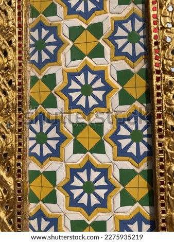 Traditional Thai pattern decorating on the column base of Wat Phra Si Rattana Satsadaram or Temple of the Emerald Buddha