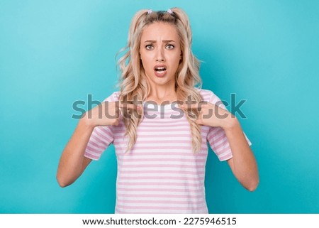 Photo of cheerful cute lady wear stylish clothes showing herself impressed unexpected choice isolated on cyan color background