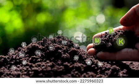 Monitor soil quality to control soil quality, soil composition concept of smart farm agricultural economic development. And there are technology icons about the composition of the soil around it. Royalty-Free Stock Photo #2275960323