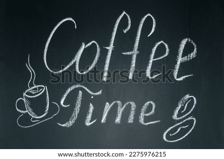 Inscriptions and phrases in chalk on a blackboard. Coffee time.