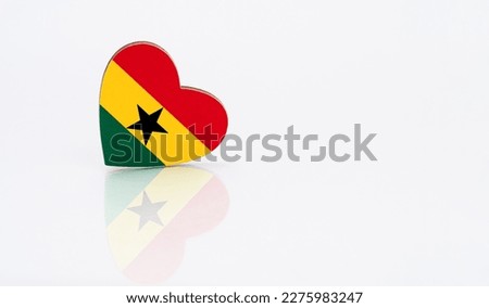 Flag of Ghana in the shape of a heart on a white background. The concept of patriotism. copyspace.