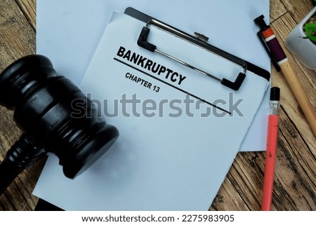 Concept of Bankrupty Chapter 13 write on paperwork isolated on Wooden Table. Royalty-Free Stock Photo #2275983905