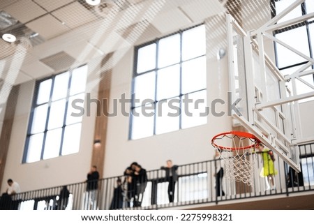 Basketball ring in arena in the background  fans.