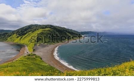 Cape Evstafiya in the Sea of ​​Okhotsk, Russia. Picturesque hills, with bright herbs and blue sea on Sakhalin. Royalty-Free Stock Photo #2275999813