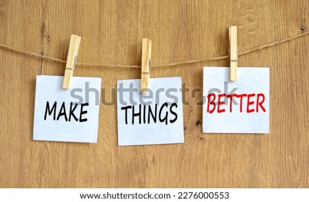 Make things better symbol. Concept words Make things better on white paper on wooden clothespin on a beautiful grey table grey background. Business and make things better concept. Copy space. Royalty-Free Stock Photo #2276000553