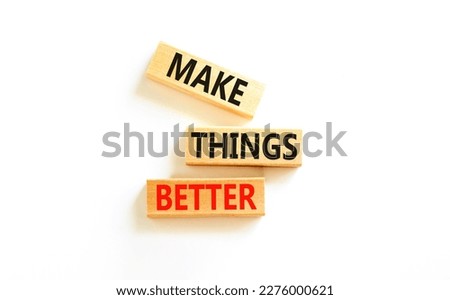 Make things better symbol. Concept words Make things better on wooden block on a beautiful white table white background. Business and make things better concept. Copy space.
