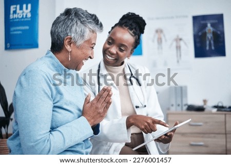 Black woman, doctor and elderly patient with good news, tablet and results for health, advice and report. Happy african medic, mobile touchscreen or healthcare with smile, tech or support in hospital Royalty-Free Stock Photo #2276001457