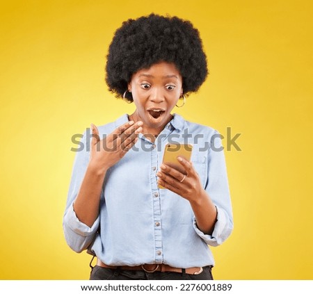 Phone, surprise and wow of black woman in studio isolated on a yellow background. Shock, cellphone and surprised female with smartphone for good news on social media, winning lottery or competition.