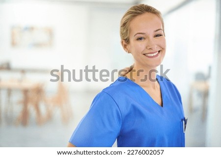 Committed to making you better. Portrait of a confident young doctor wearing blue scrubs.