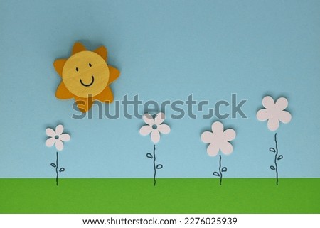 Happy spring greeting card with sun and flowers