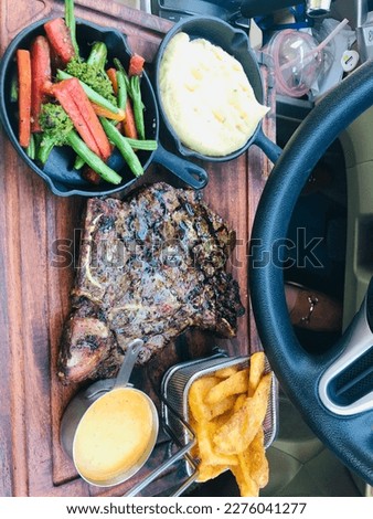 Pictures of gourmet meals, a steak with two sides