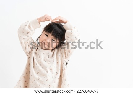 Smiling Asian child on white background