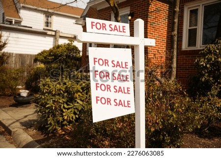 For sale for rent sign in front of home showing economic signs of increased inflation and mortgage rates depicting housing market crisis and financial troubles 