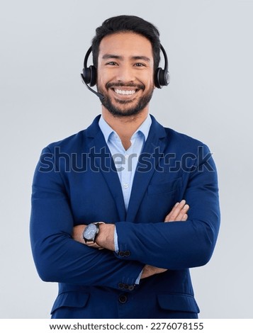 Call center, customer service and portrait of man with smile for communication, consulting and crm network. Contact us, support mockup and happy male consultant in studio for help, service and sales Royalty-Free Stock Photo #2276078155