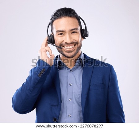Headset portrait of happy man isolated on a white background call center, telecom job or global support. International callcenter agent, consultant or business person face in studio communication Royalty-Free Stock Photo #2276078297