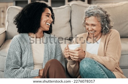 Love, mother and adult daughter on floor, coffee and conversation with happiness, break and laughing. Family, mama and female grown child on ground, tea and smile with rest, funny and quality time Royalty-Free Stock Photo #2276078317