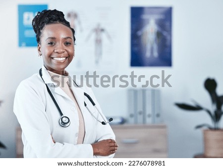 Happy, portrait and black woman doctor proud in hospital, excited or cheerful for healthcare innovation. Face, confident and female health expert smile for medical, mission or ready to help at clinic Royalty-Free Stock Photo #2276078981