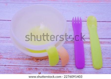Pictures of tableware, bowls and cutlery for baby food