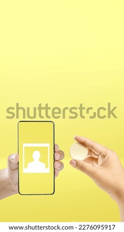 Human hand holding mobile phone screen with photo symbol on a colored background