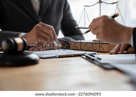 Lawyer, legal advisor, Asian businessman explaining agreement details Business contracts to investors and brainstorming Take notes for accuracy in the document before signing the contract together.