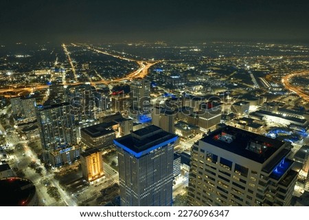Night urban landscape of downtown district of Tampa city in Florida, USA. Skyline with brightly illuminated high skyscraper buildings in modern american megapolis