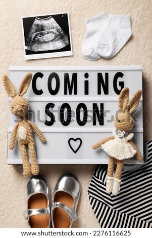pregnancy announcement background with baby items. Top View. Baby is coming. enjoying future parenthood. Baby Coming soon concept. Baby announcement sign. ultrasound pregnancy image.