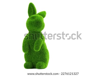 Easter bunny or rabbit. Green grass bunny. Good for Easter egg hunt project. Happy Easter. Figure or statue Easter bunny for desk decoration. High resolution photo. Isolated white background.