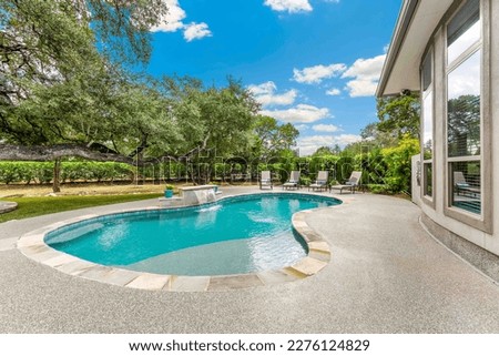 a luxury home with a swimming pool  Royalty-Free Stock Photo #2276124829