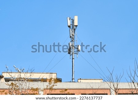 Telecom signal transmitting base station on the roof of a residential building in Chengdu, China Royalty-Free Stock Photo #2276137737
