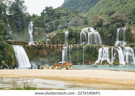 Beautiful scenery of Ban Gioc waterfall with trees and green water in Cao Bang, Vietnam