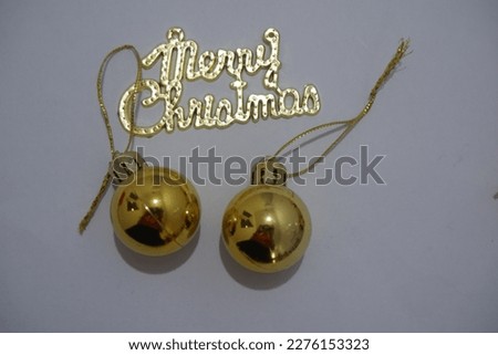 Christmas ornaments with gold nuances which are usually used to decorate Christmas trees and room decorations