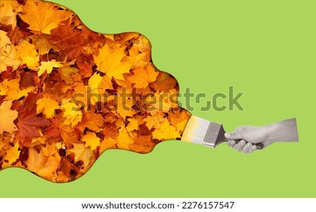 Contemporary art collage of hand holding painting brush with autumn leaf. Creative minimalism concept. Modern design. Copy space.