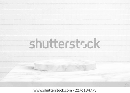 Minimal Marble Cylinder Podium on the Table with White Tile Wall Texture for Background, Suitable for Premium Product Presentation Backdrop, Display, and Mock up.