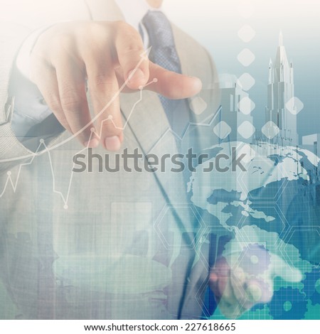 Double exposure of businessman hand working with new modern computer and business strategy as concept 