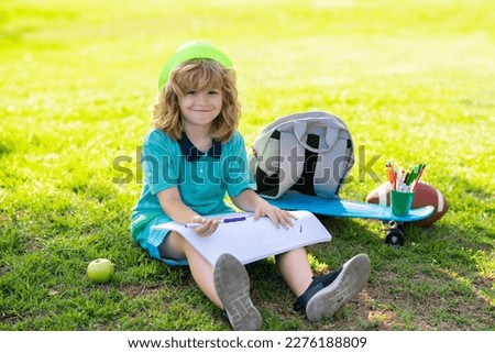 Child play and draw craft artwork homework. Child artist, kids crafts. School kids drawing in summer park, painting art. Little painter draw pictures outdoor.