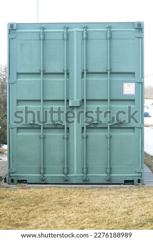 Cargo container for shipping of goods in the city, closeup of photo
