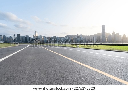 empty road wity city skyline in hong kong china
