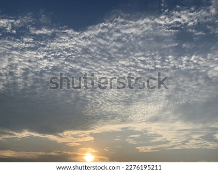 Altocumulus clouds are full of streaks of beautiful and Imagination is like an eagle spreading its wings across the sky at Thailand.no focus
