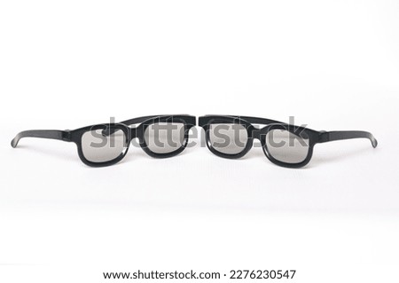 two glasses for watching stereo movies. on a white background. front view. selective focus on the middle of the frames