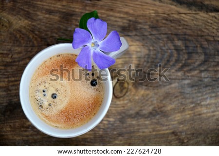 Coffee mug decorated on dark brown old wood
