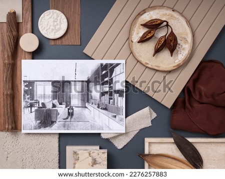 Creative flat lay composition in blue, beige and brown color palette with textile and paint samples, lamella panels and tiles. Architect and interior designer moodboard. Top view. Copy space. 