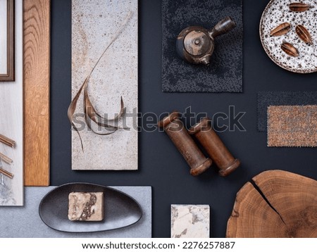 Creative flat lay composition with textile and paint samples, panels and cement tiles. Stylish interior designer moodboard. Navy, gray and brown color palette. Copy space. Template. 